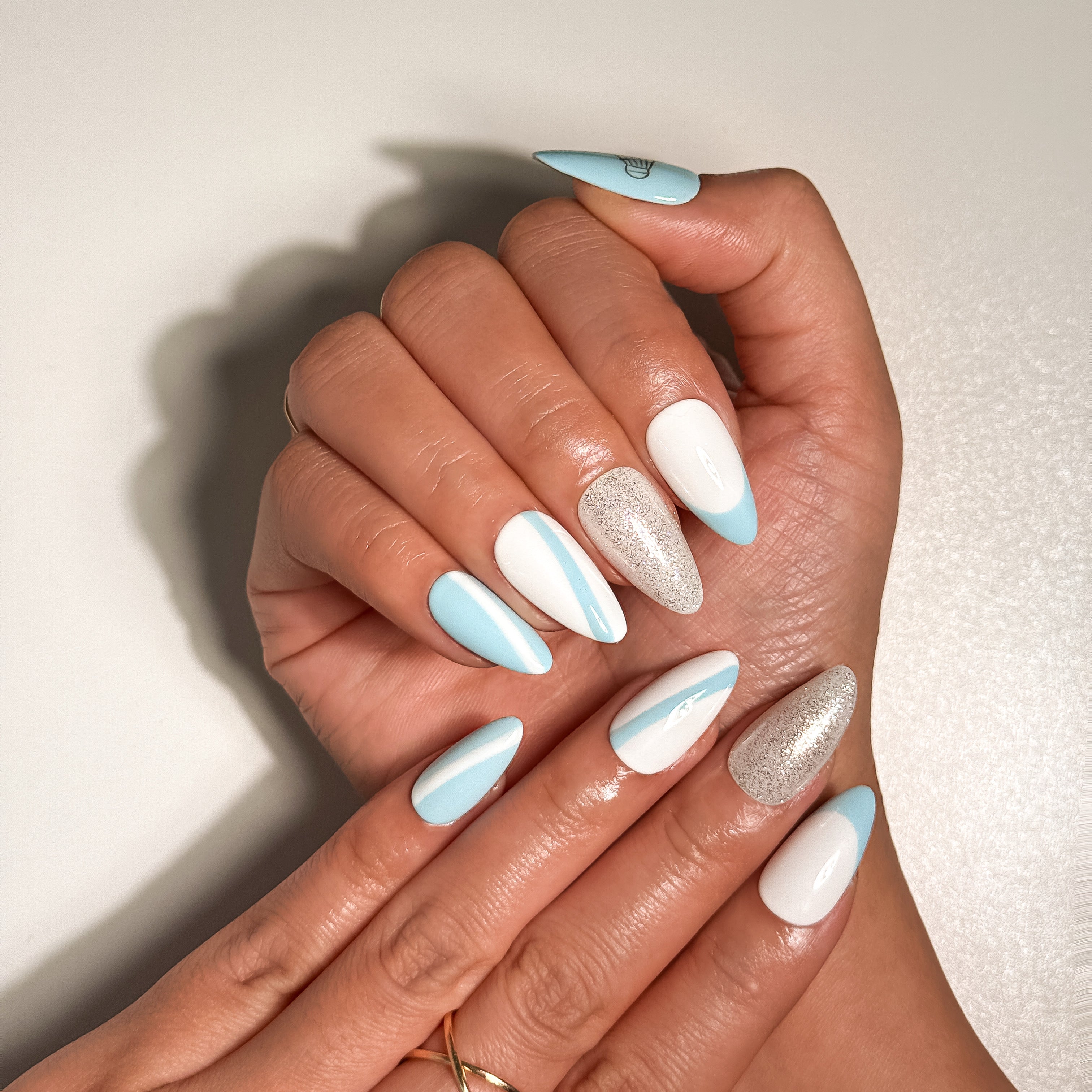 Shuttle Swing Soft Blue and White Sporty Press on Nails with Silver