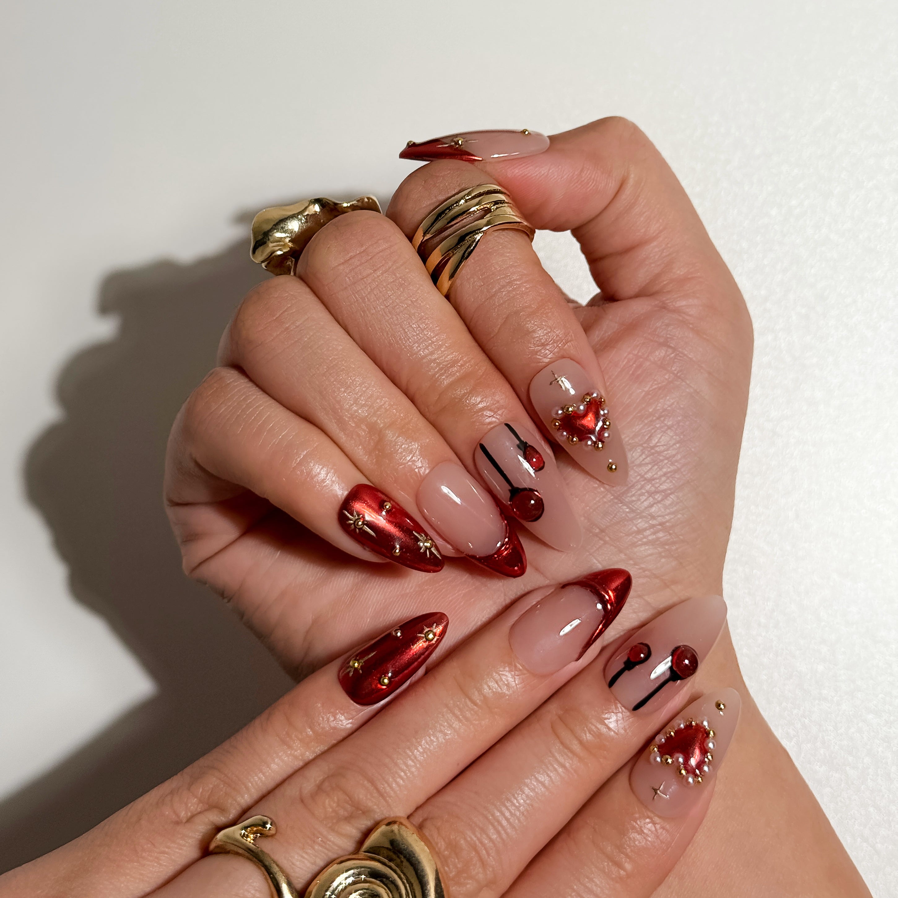 Stardust Nude Press on Nails with Red Tips and Pearl Hearts