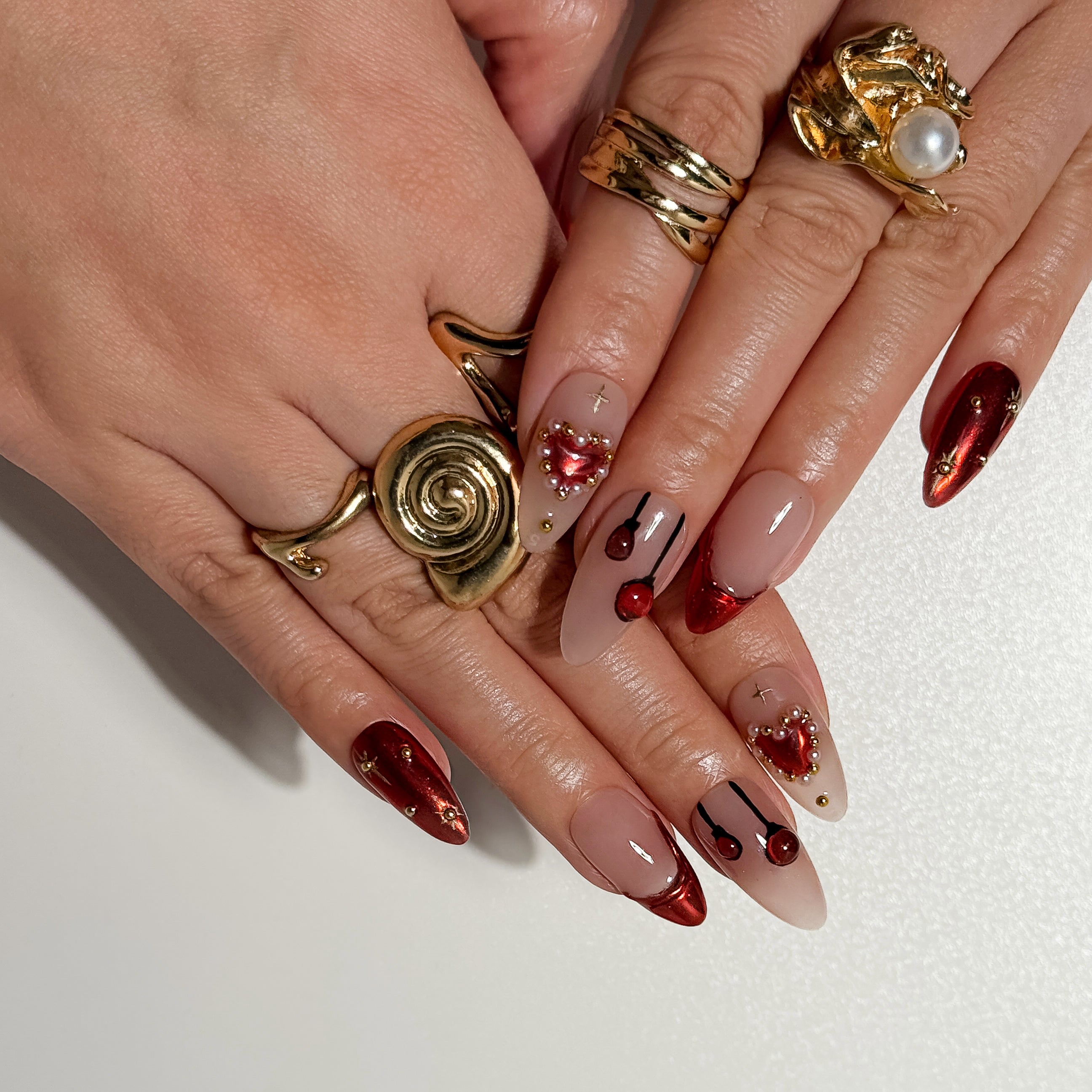 Stardust Nude Press on Nails with Red Tips and Pearl Hearts